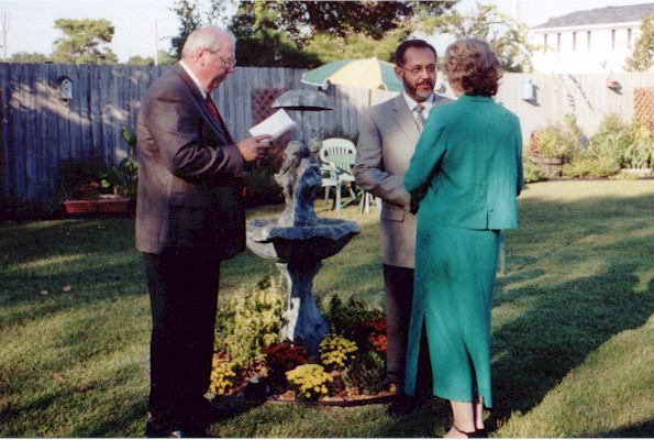 Rev. Jimmie Spikes reading the vows.