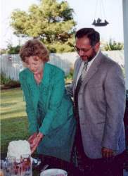 Cutting the wedding cake.