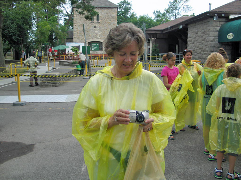 Gloria looked nice in her yellow poncho; needed for walking below the falls.