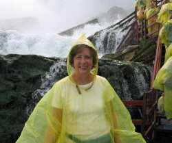 Gloria looked nice in her yellow poncho; needed for walking below the falls.