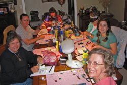 Gloria teaching a wire wrapping class at the house.