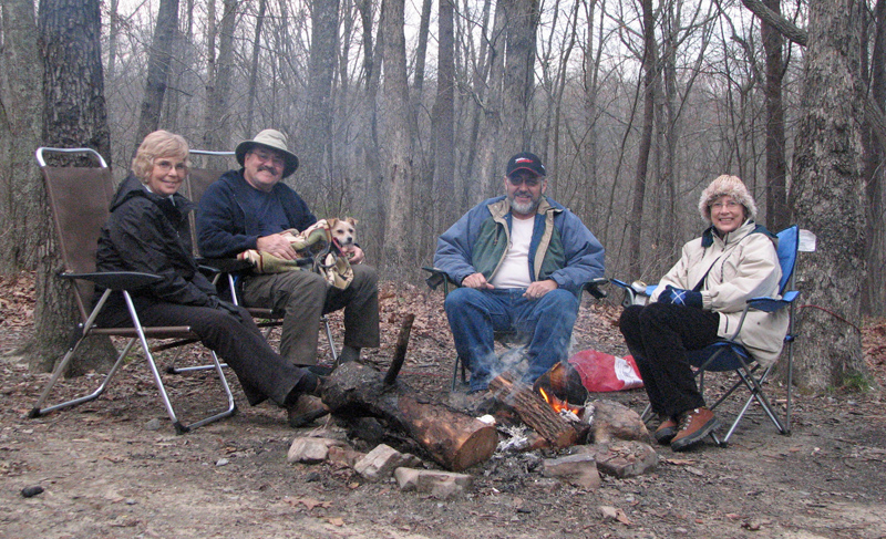 Around the campfire with Sona, George and Trixie the dog.