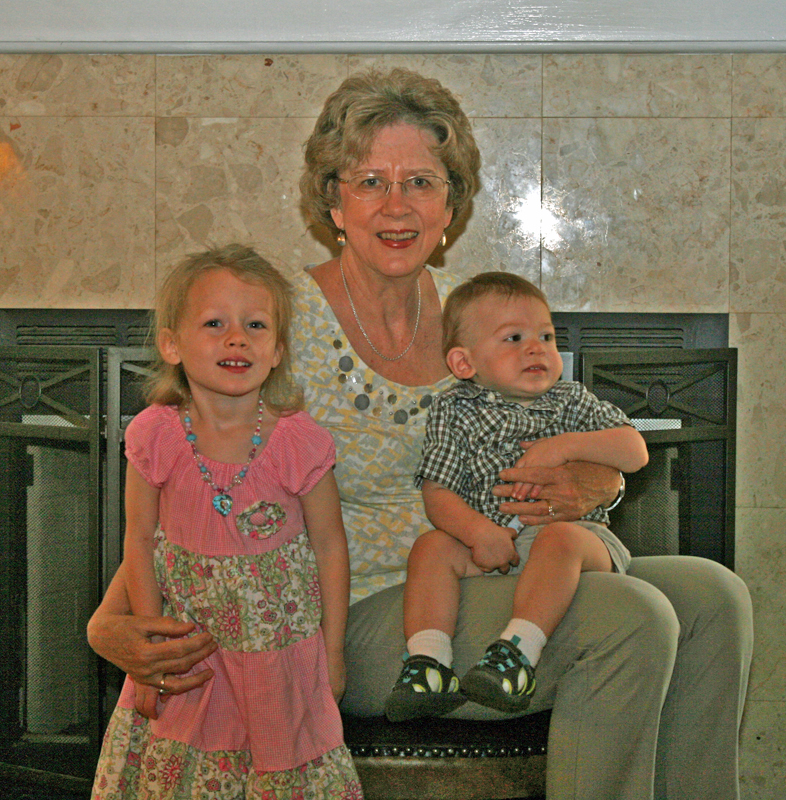Gloria with grandchildren C and A.  Photoshopping this very dark photo gave an oddly satisfying look.