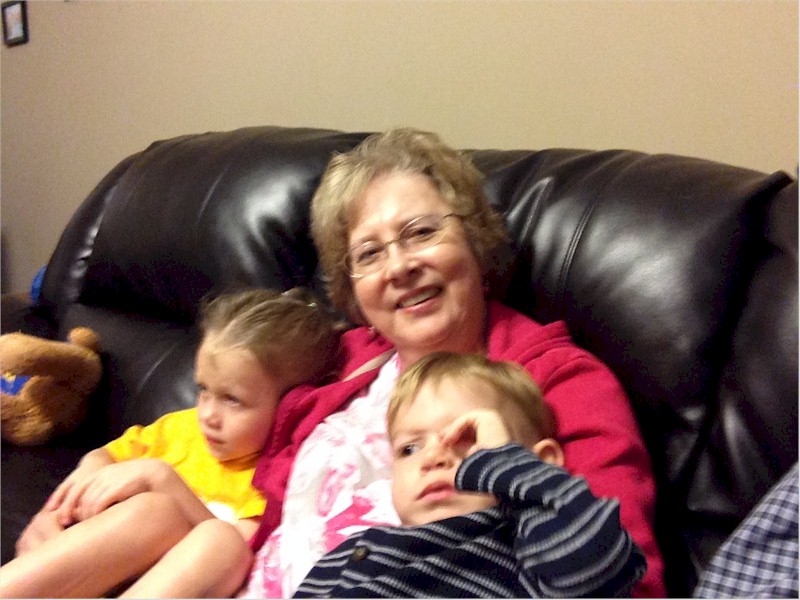 The grandkids always piled on whenever Gloria was sitting down.  She loved that.