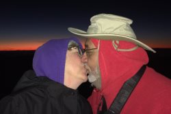 We got up at 3AM so we could get a good spot on the handrail at cliff's edge.  My first kiss on a volcano!  Hot!